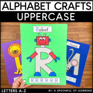 Holding the uppercase letter R craft to show an example of the completed craft.