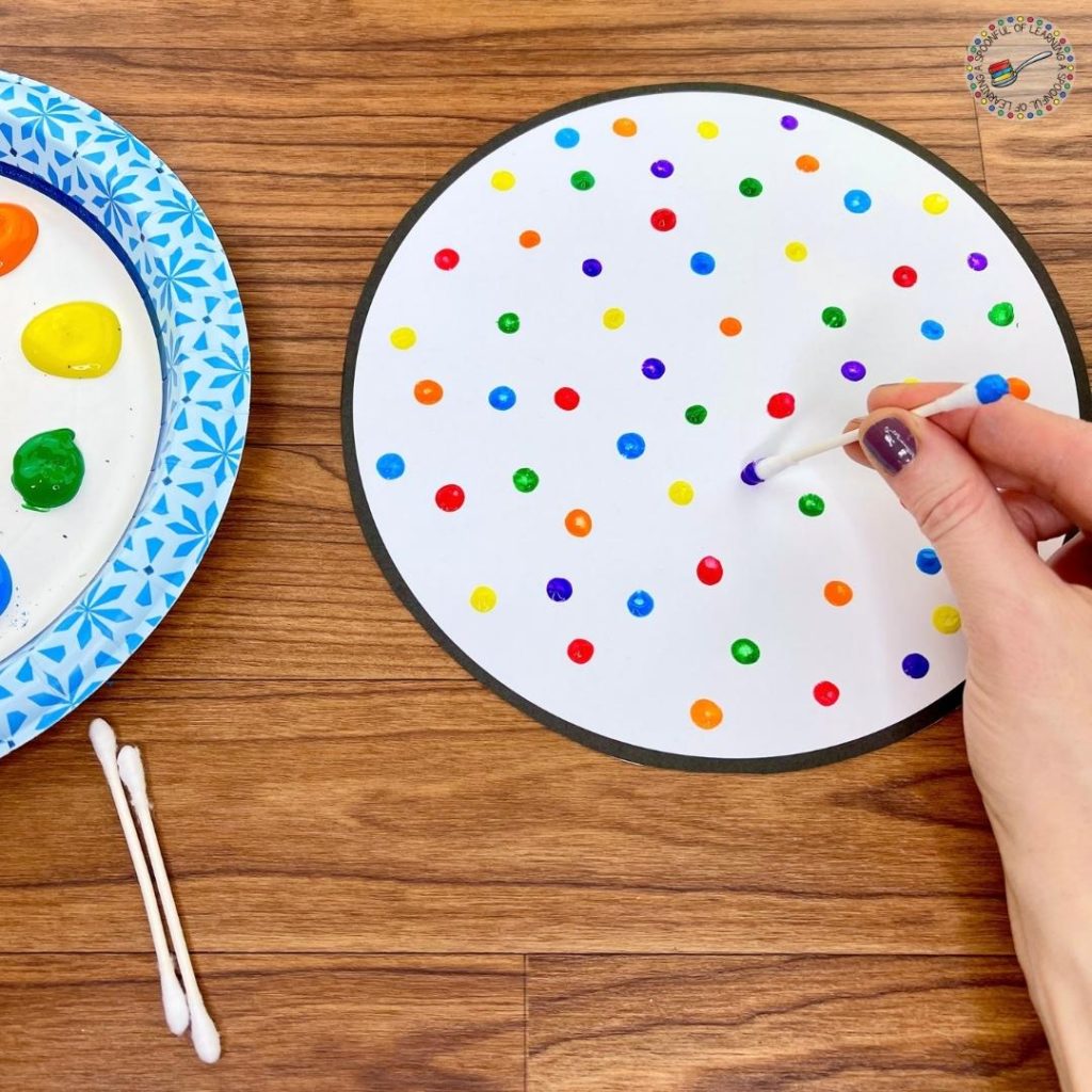 Painting dots on a gumball machine craft