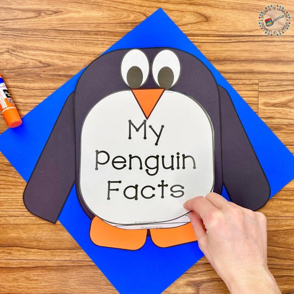 Write the facts that has been learned about penguins in a book that is placed on a penguin craft.