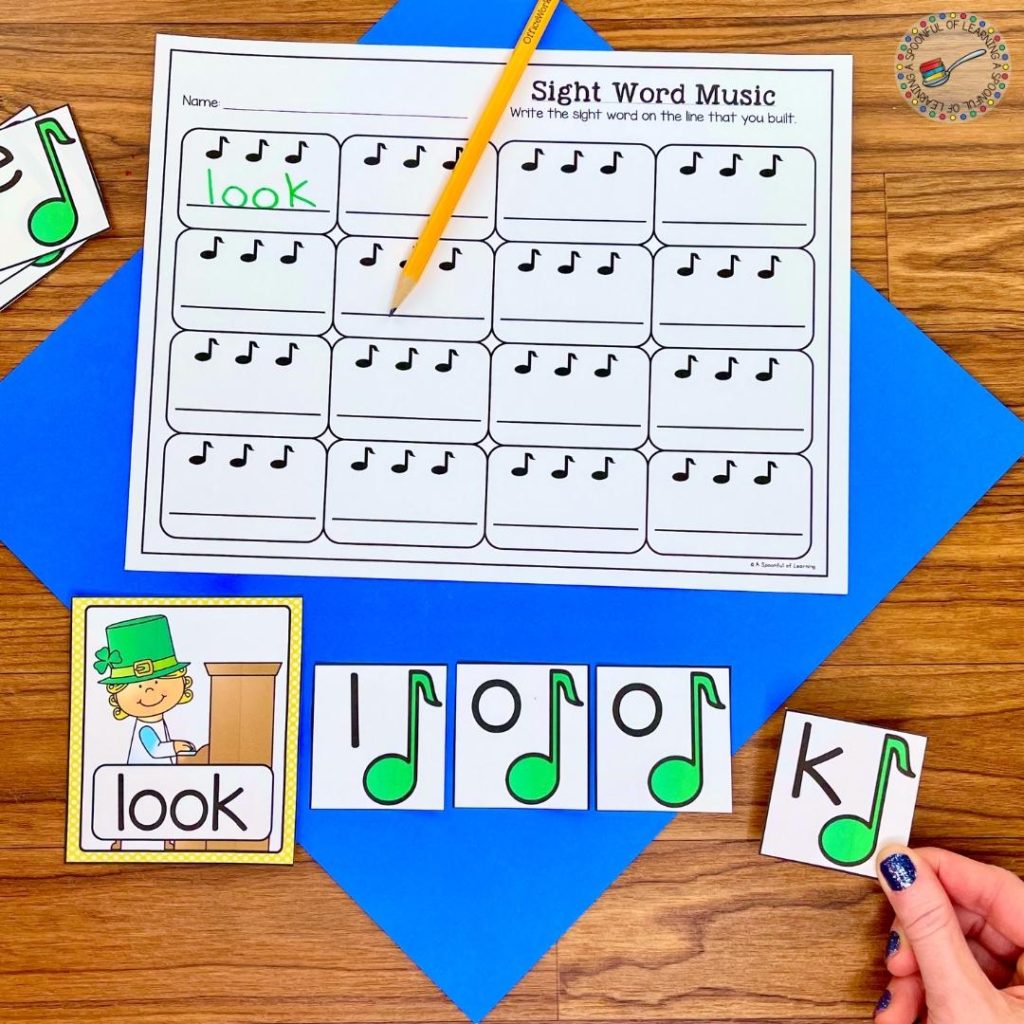 A student is building a sight word using letters with music notes to go along with this March literacy activity.