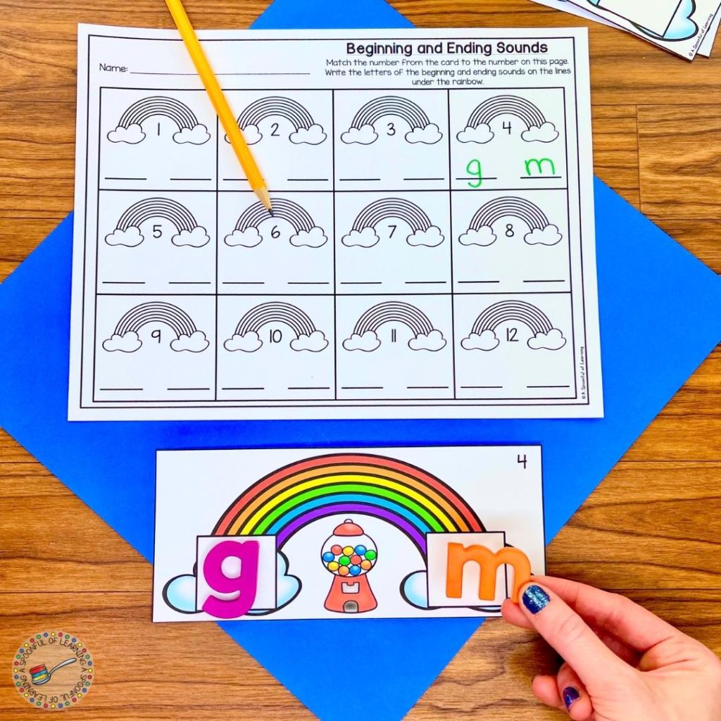 This phonemic awareness activity has a student place the beginning and ending sound letters for the word gum on the rainbow using magentic letters. They placed the letter g for the beginning sound and the letter m for the ending sound.