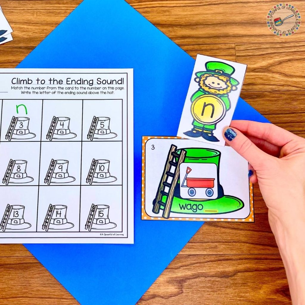 An example of an ending sound center activity for March. A student determined the ending sound letter of the word wagon and placed the leprechaun with the letter n on top of the hat.