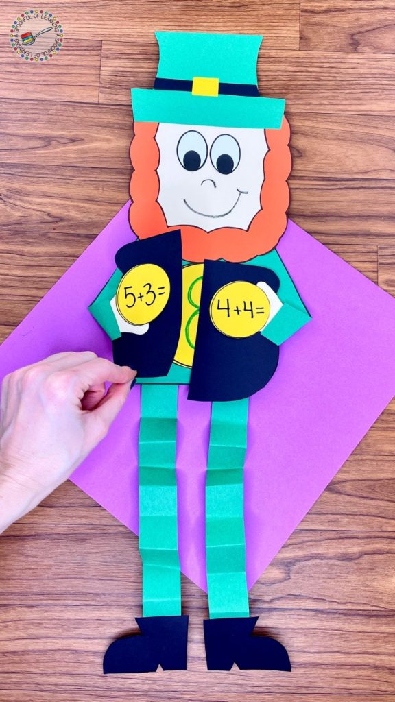 A St. Patrick's Day craft for kids where students write an addition and subtraction equation that equals the number that is on the large coin.