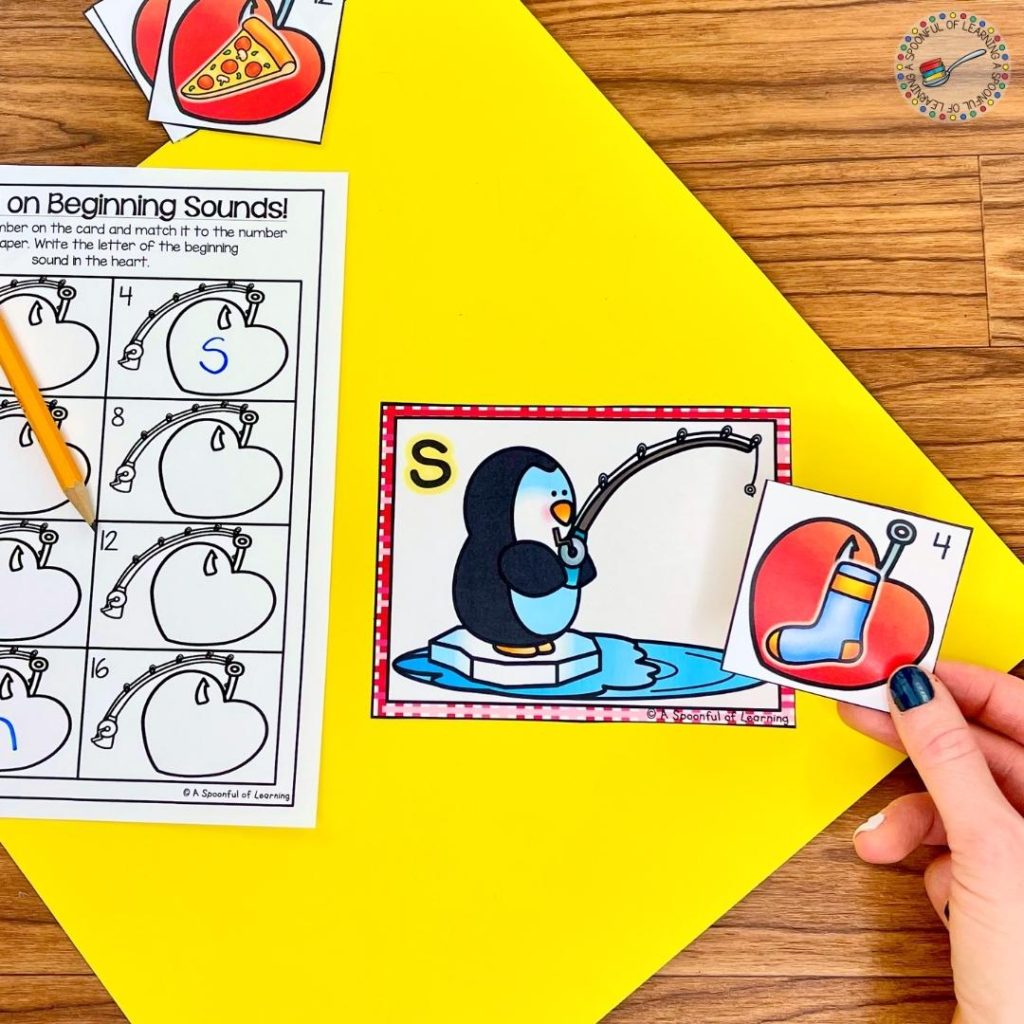 A Valentine's Day center literacy center where students match the picture to the correct beginning sound letter.