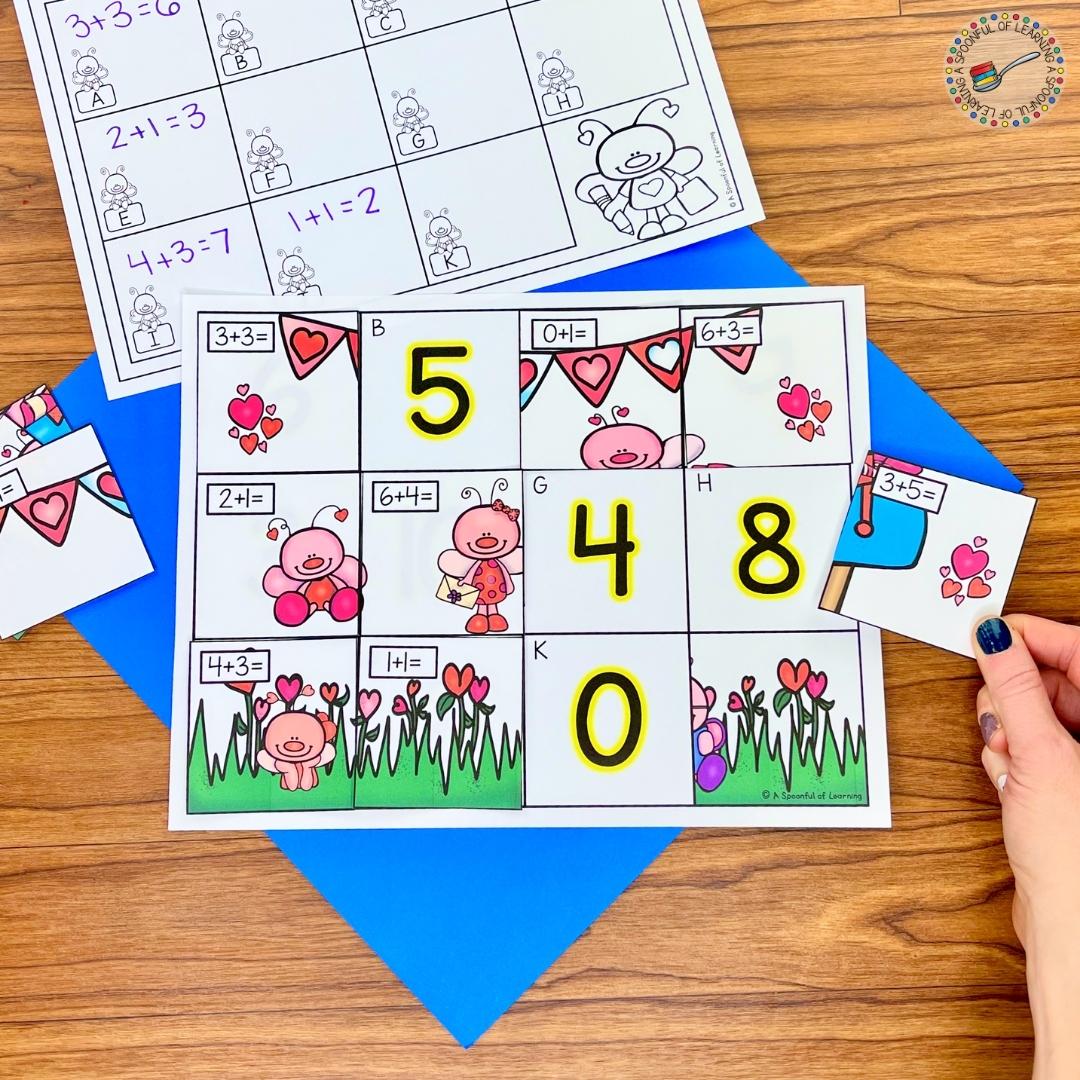 Students match the addition equations to the correct sum on the mat to reveal a mystery picture. This activity is included in the free Valentine's Day centers.