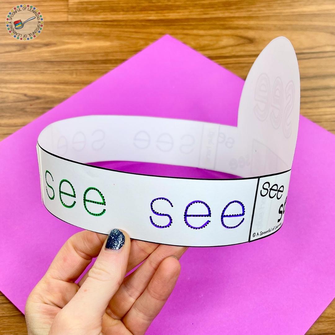 This is a side view of the hands on sight word activity for the sight word "see". Students trace the sight word "see" on the sides of the hat.