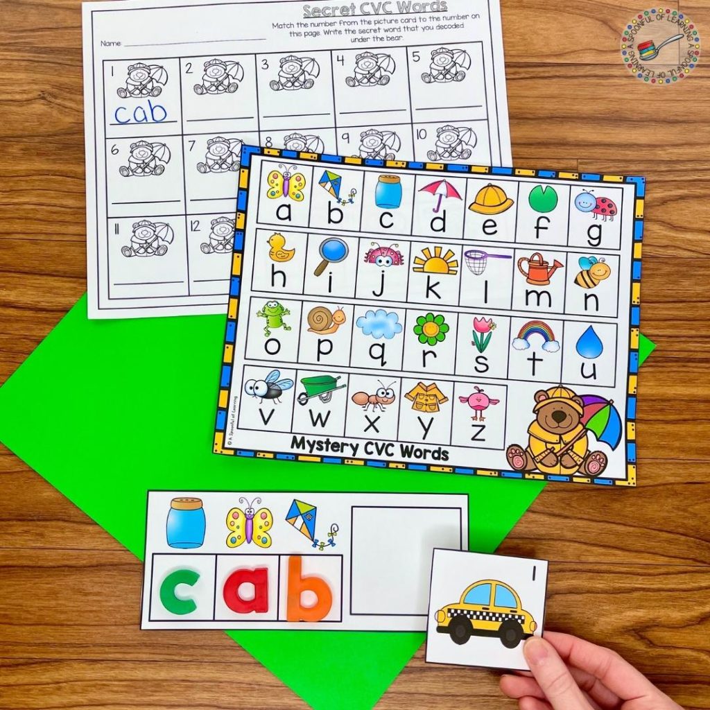 A spring literacy centers activity where students use a code to build a CVC word. Then, they read the CVC word they built and find the correct picture that matches the CVC word. Make it more engaging by using magnetic letters!