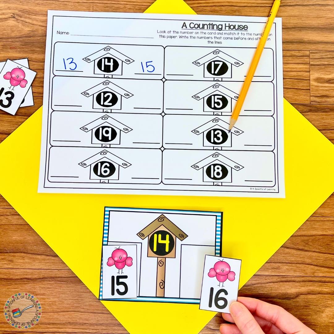 In this kindergarten math center, students look at the number on the bird house and find the cards with the birds on them that have one more and one less of the number on the house to strengthen their number sense.