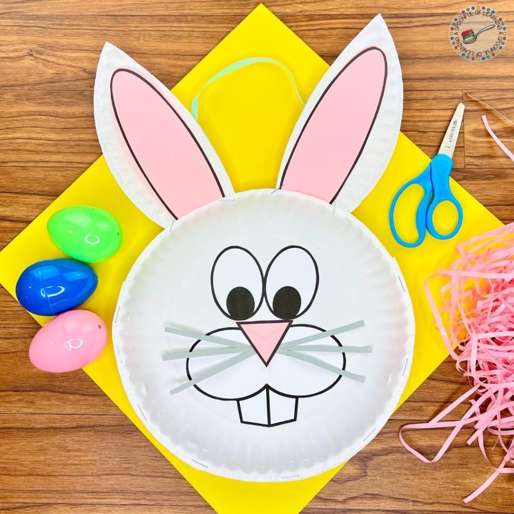 A completed free Easter craft that is an Easter Bunny basket made out of paper plates.