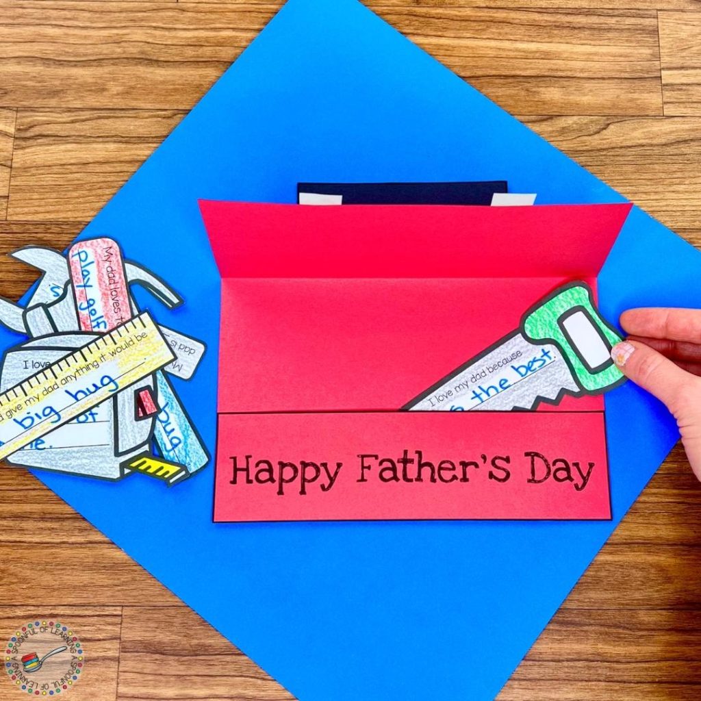 Placing tools into the Father's Day craft tool box