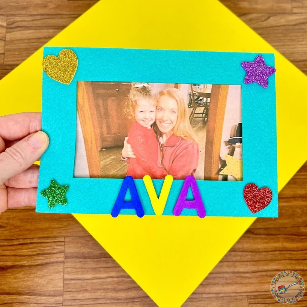 Completed picture frame with a picture of an adult and child. 