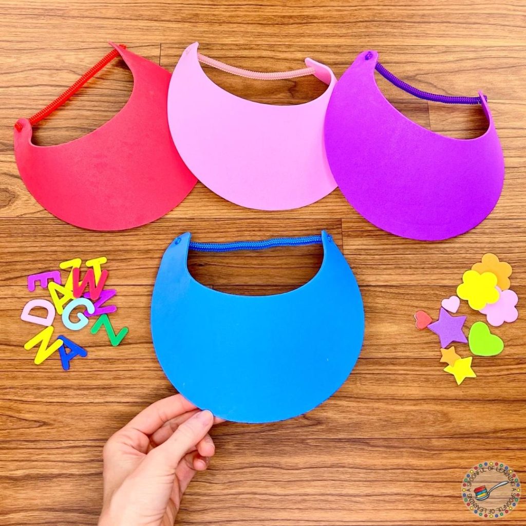Four colorful foam visors and foam stickers.