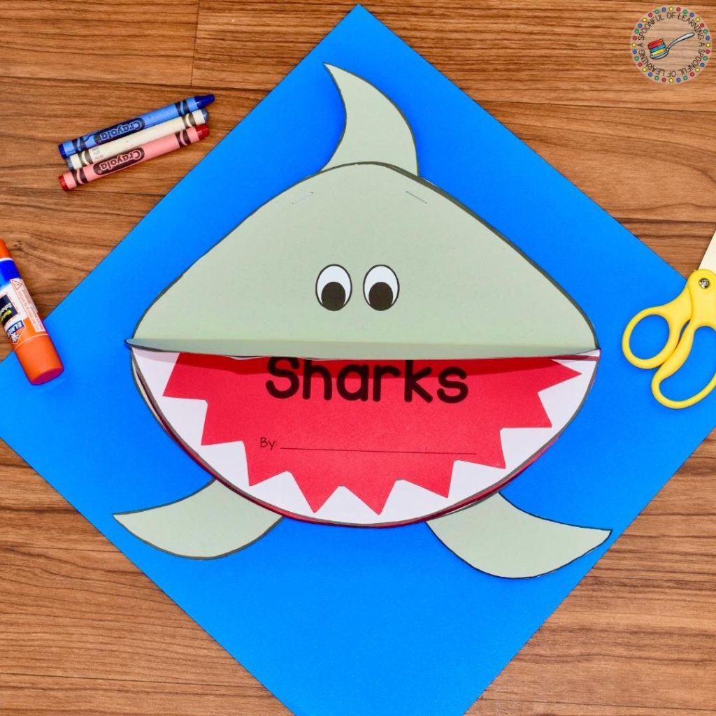 Shark-shaped paper cover for a Shark writing activity