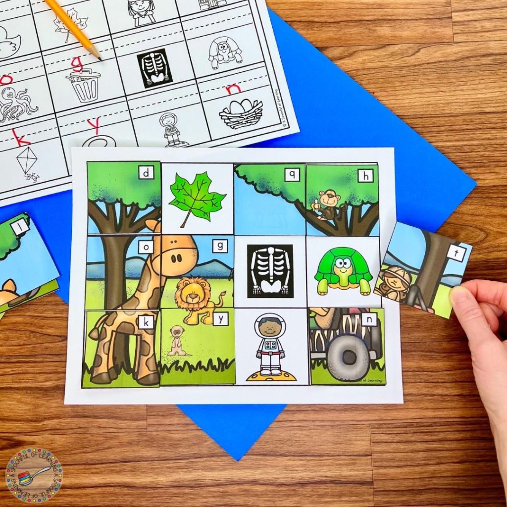 Matching puzzle pieces with uppercase letters to a picture with the associated beginning sound.