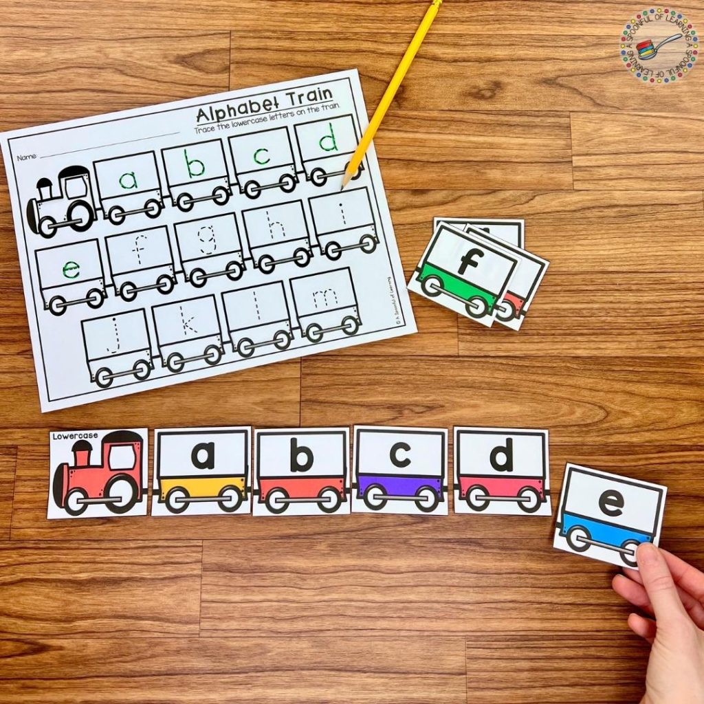 A train theme alphabet center where lowercase letters are being linked in alphabetical order
