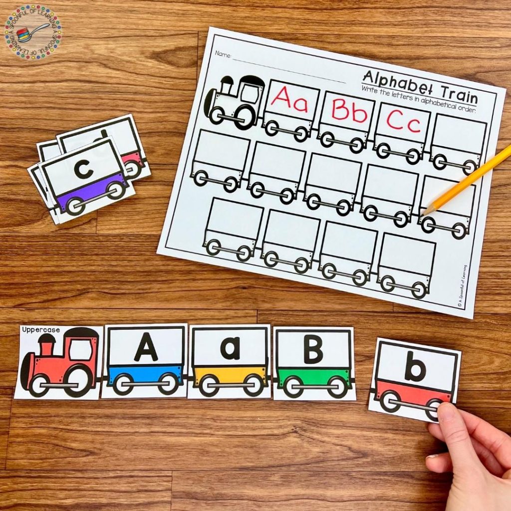 A train theme alphabet center where uppercase numbers are being linked to lowercase letters