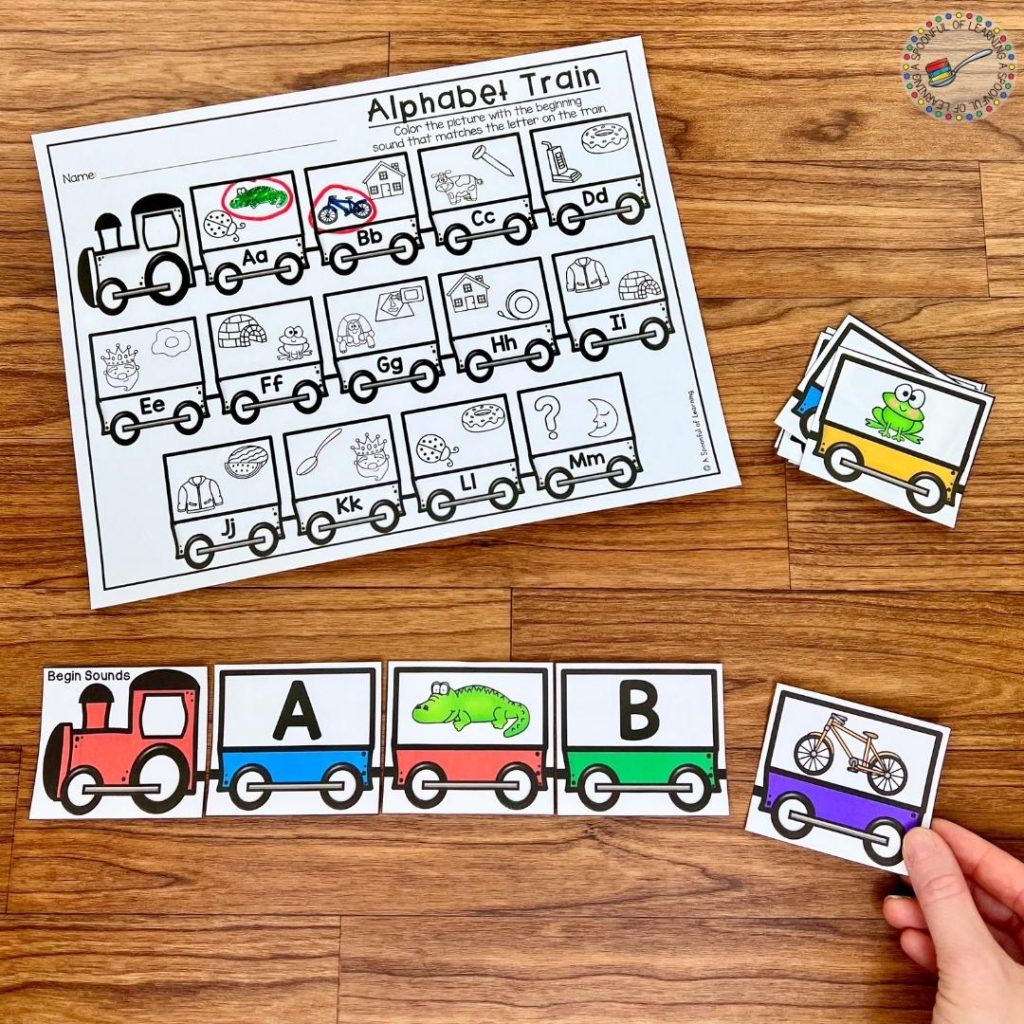 A train theme alphabet center with uppercase letters being linked up with pictures