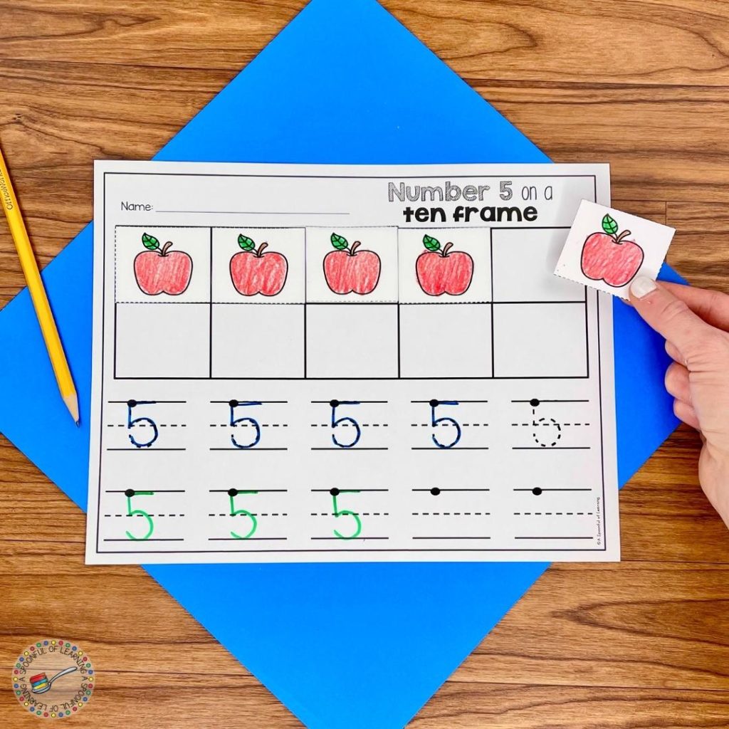 Putting paper apples onto a ten frame