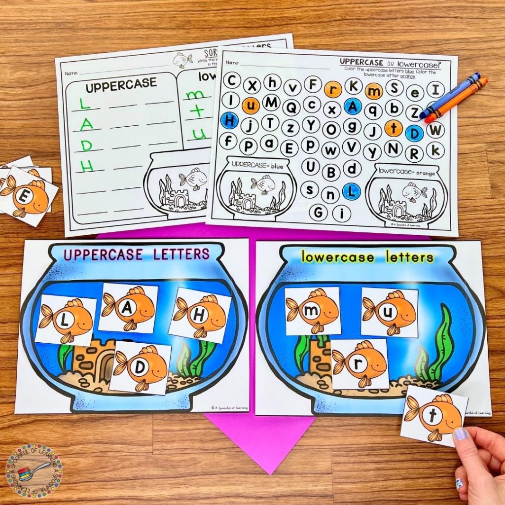 Two papers with fish bowls - one for uppercase letters and one for lowercase letters - with goldfish being sorted.
