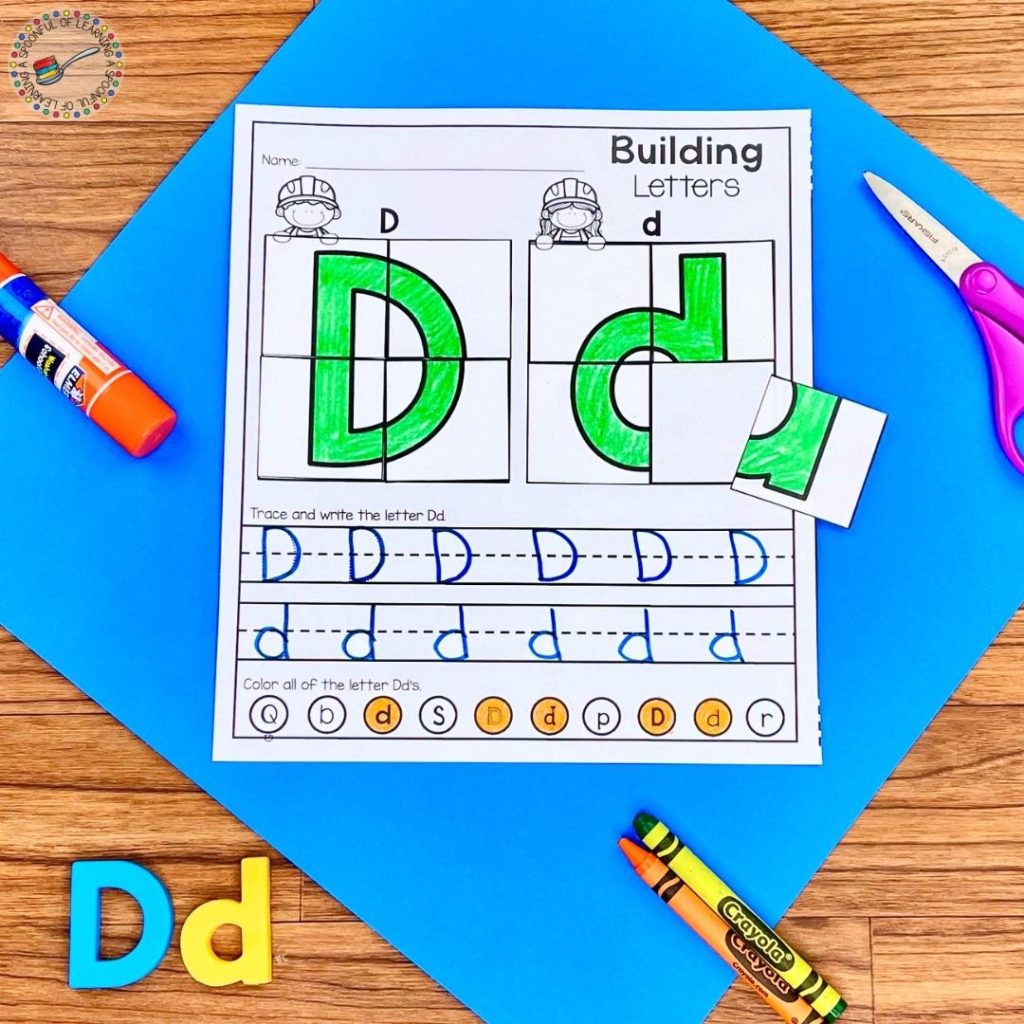 A letter building puzzle worksheet for the letter D
