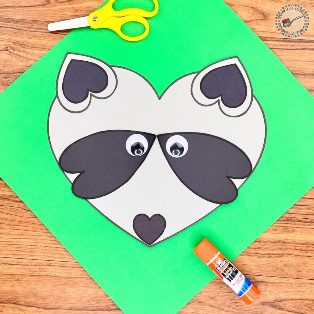 A raccoon craft made with heart shapes