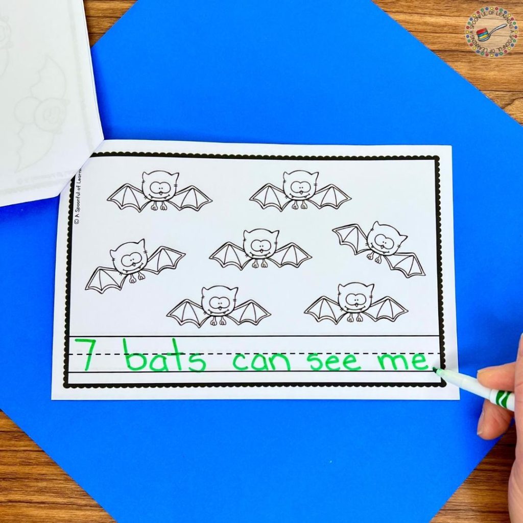 Writing a sentence in a bat counting mini reader