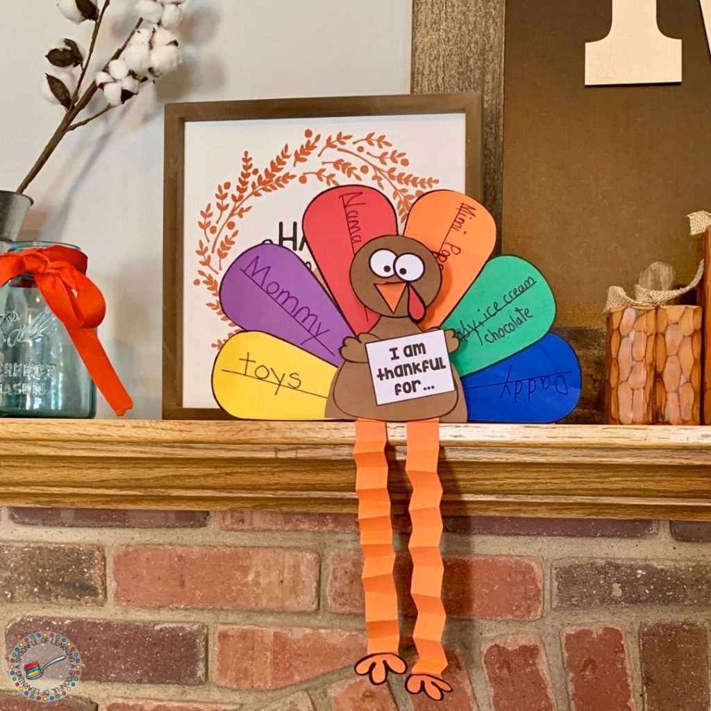 A turkey craft sitting on a brick mantle