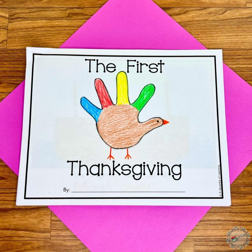 Handprint turkey on the cover of a Thanksgiving printable book