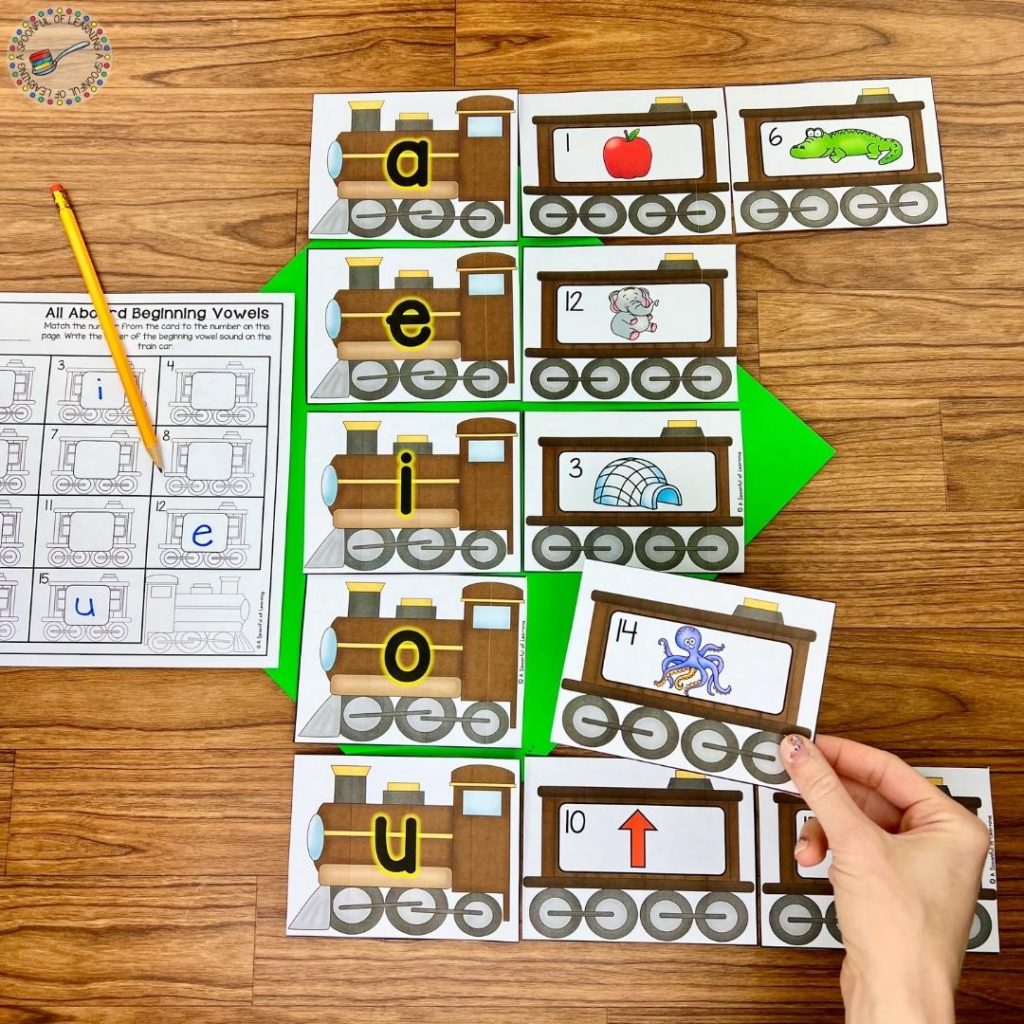 Creating trains using picture cards and vowel cards