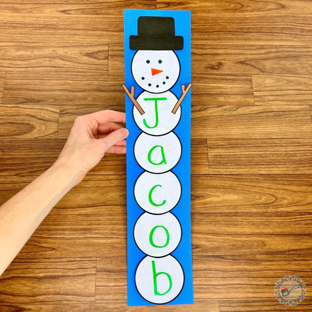 A snowman craft that spells out Jacob