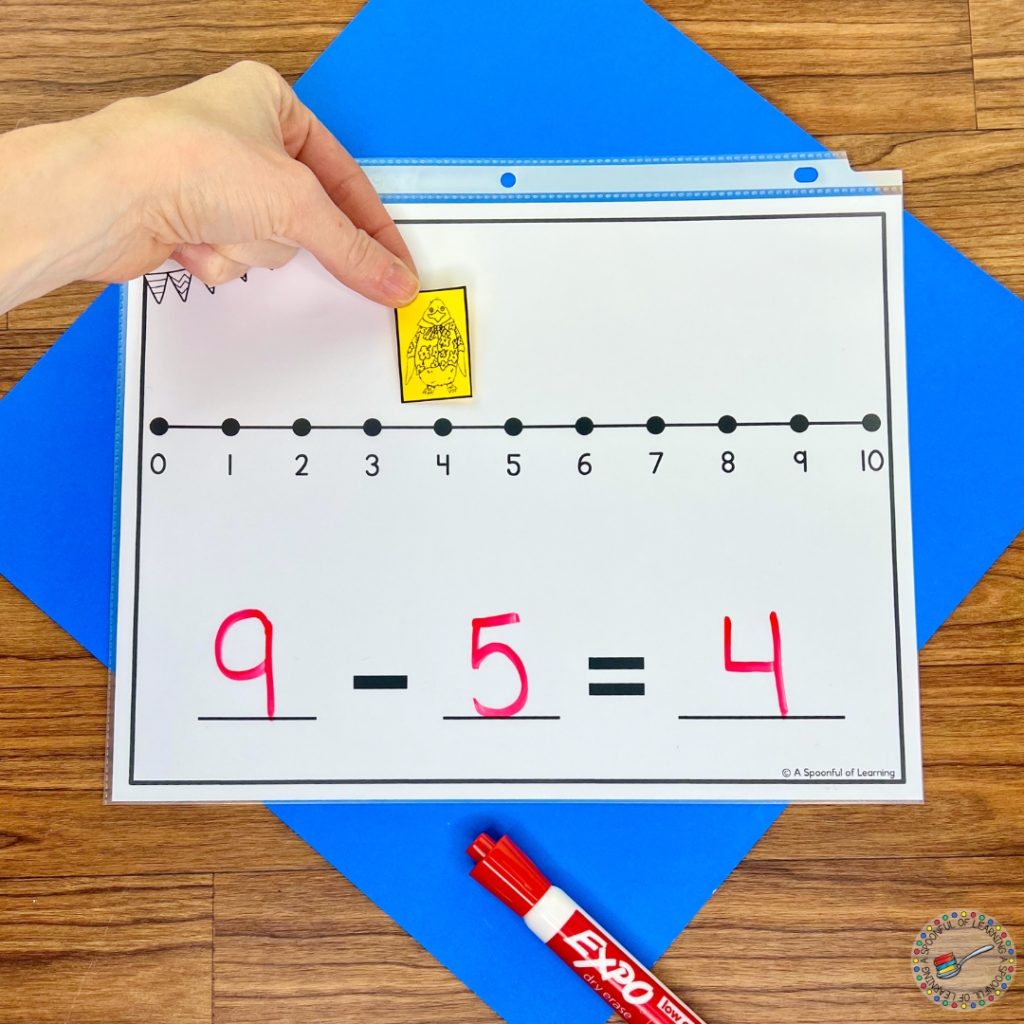 A number line mat with space to write a subtraction problem