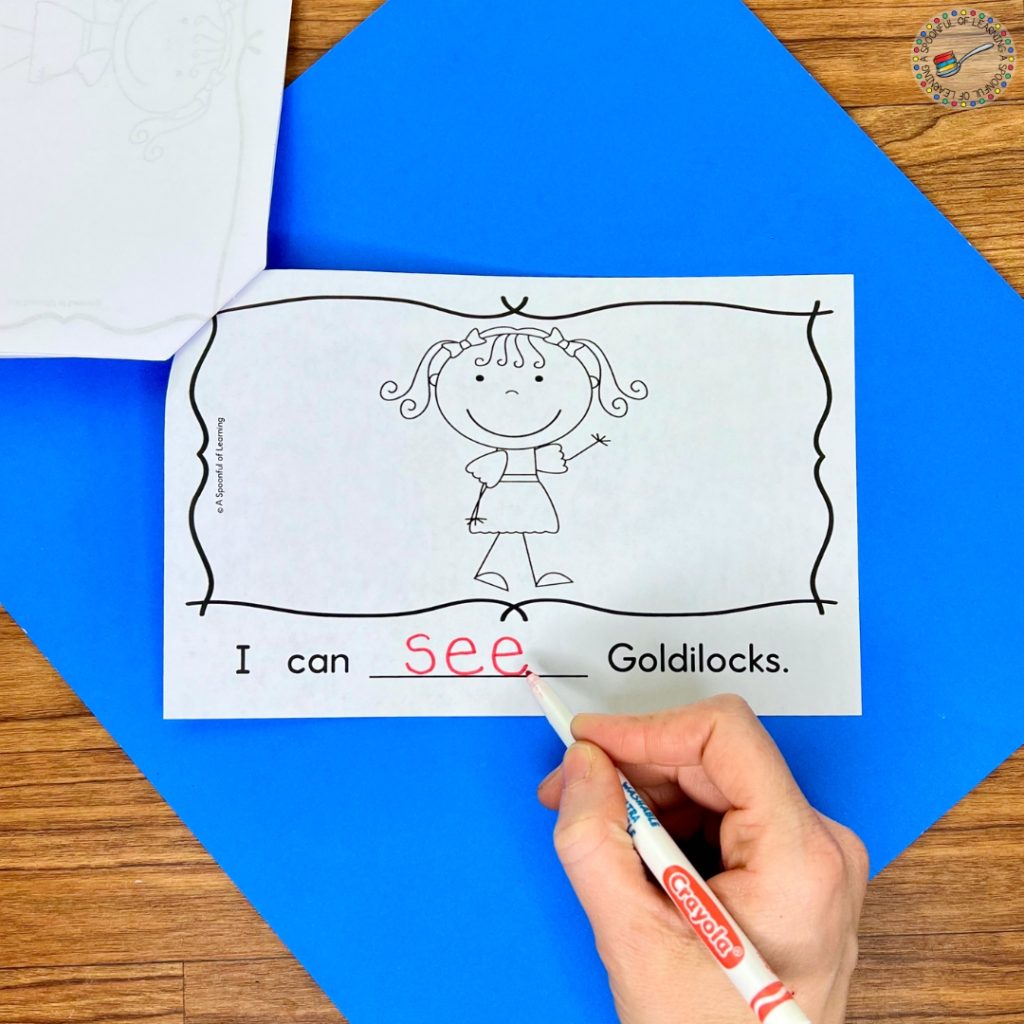Writing the word "see" on a page about Goldilocks