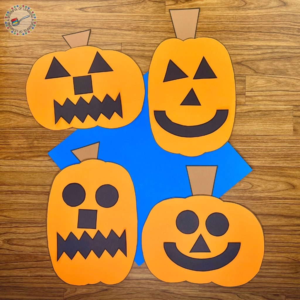 Four completed pumpkin glyph crafts