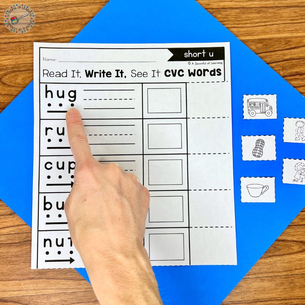 Pointing to letters in the word "hug"