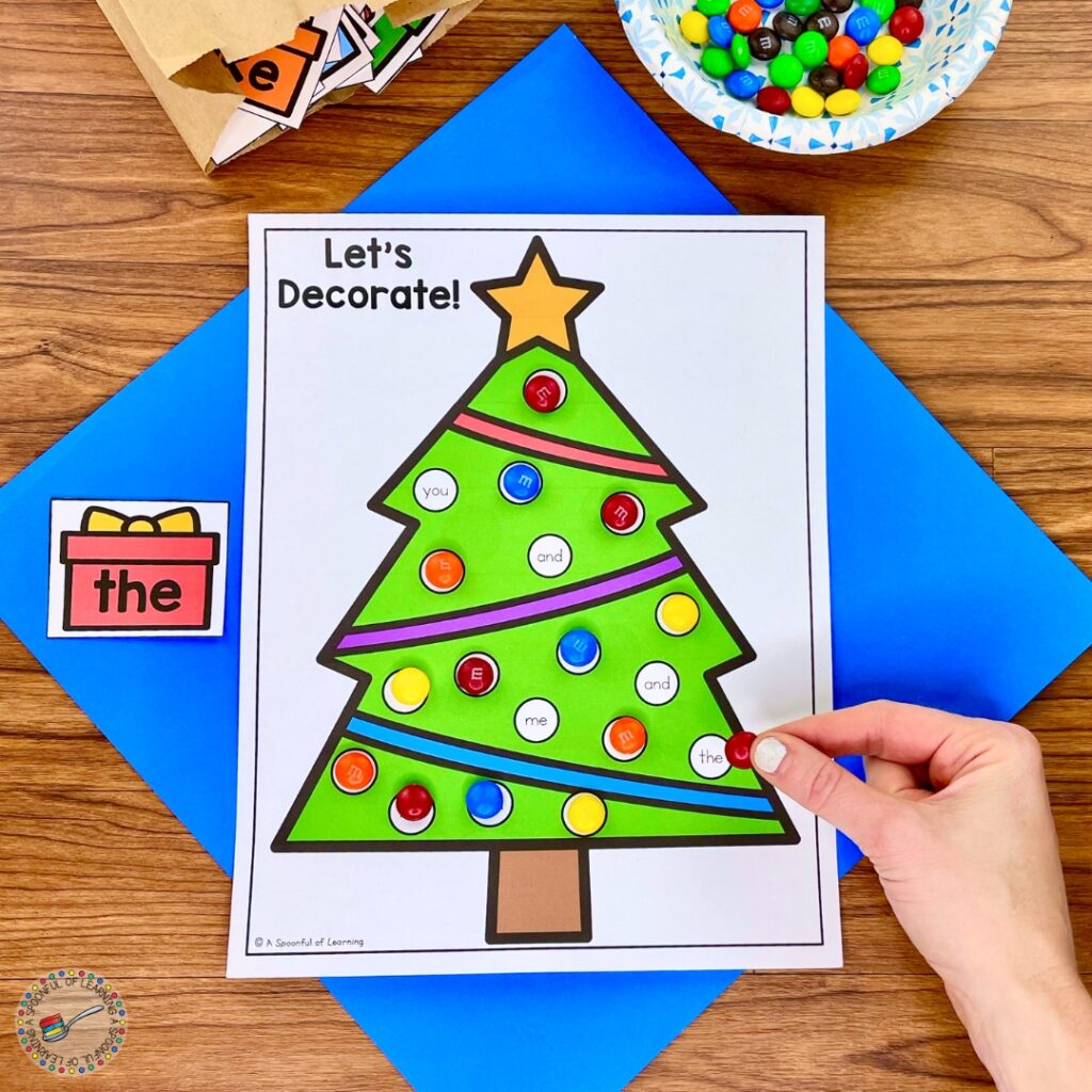 Adding candy to a Christmas tree game mat