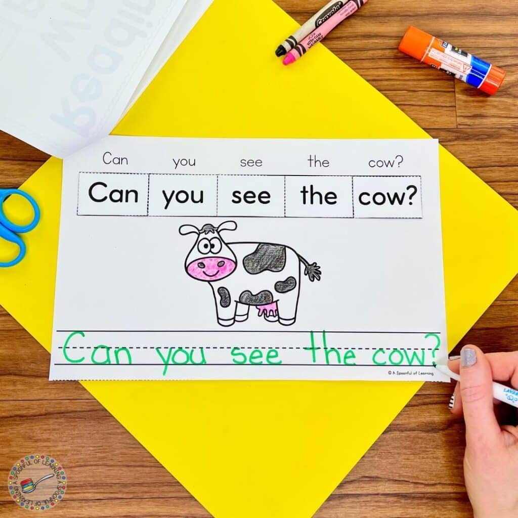 Writing the sentence "Can you see the cow?"