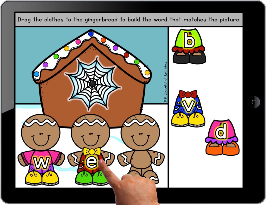 Child assembling gingerbread men on a digital literacy activity