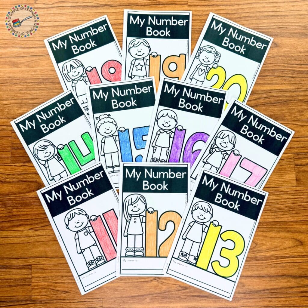 A variety of teen number books for 11-20 spread out on a table