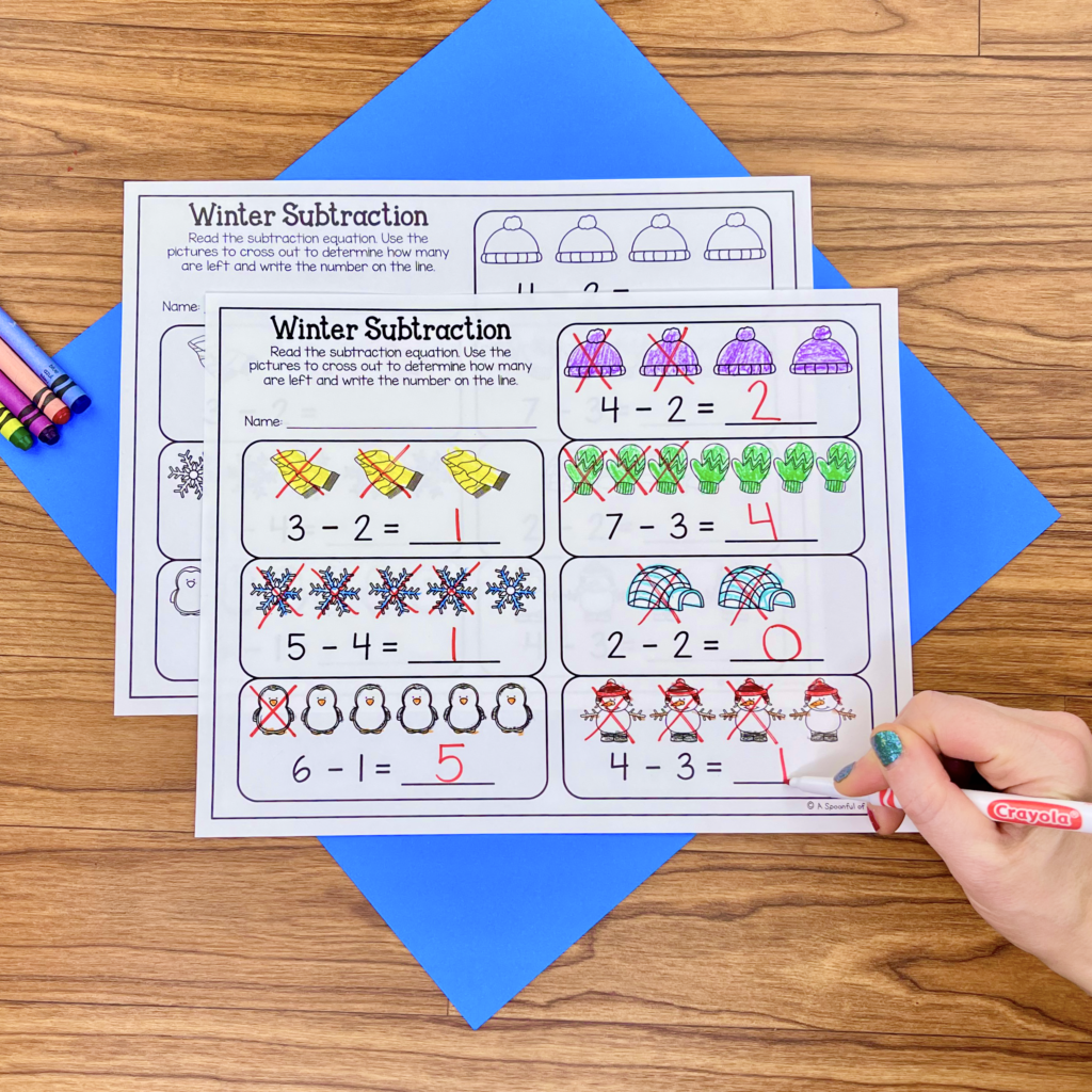 A winter subtraction worksheet with a variety of winter objects