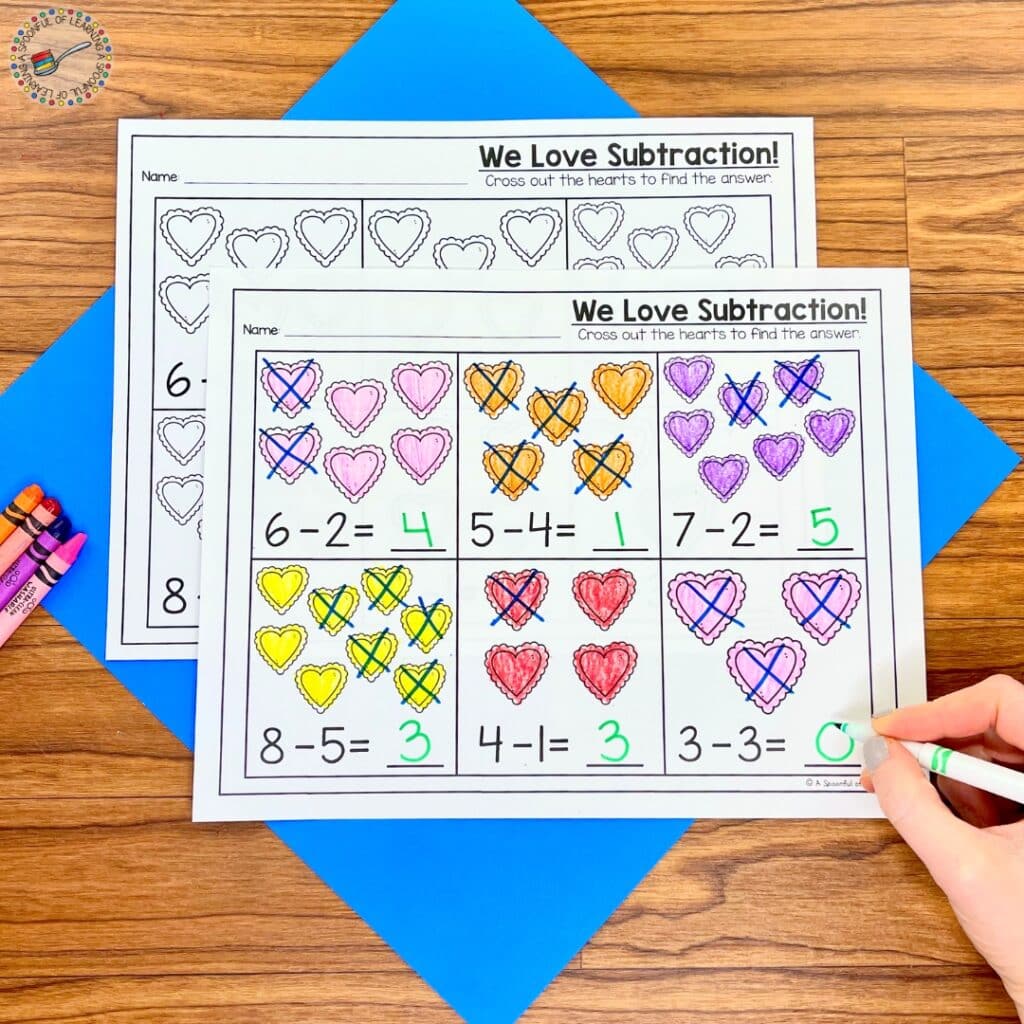 Crossing out hearts to model and solve subtraction problems