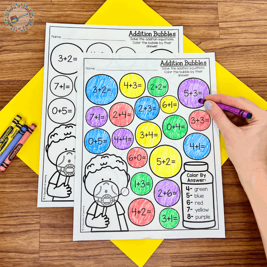 Coloring bubbles on a page of addition practice