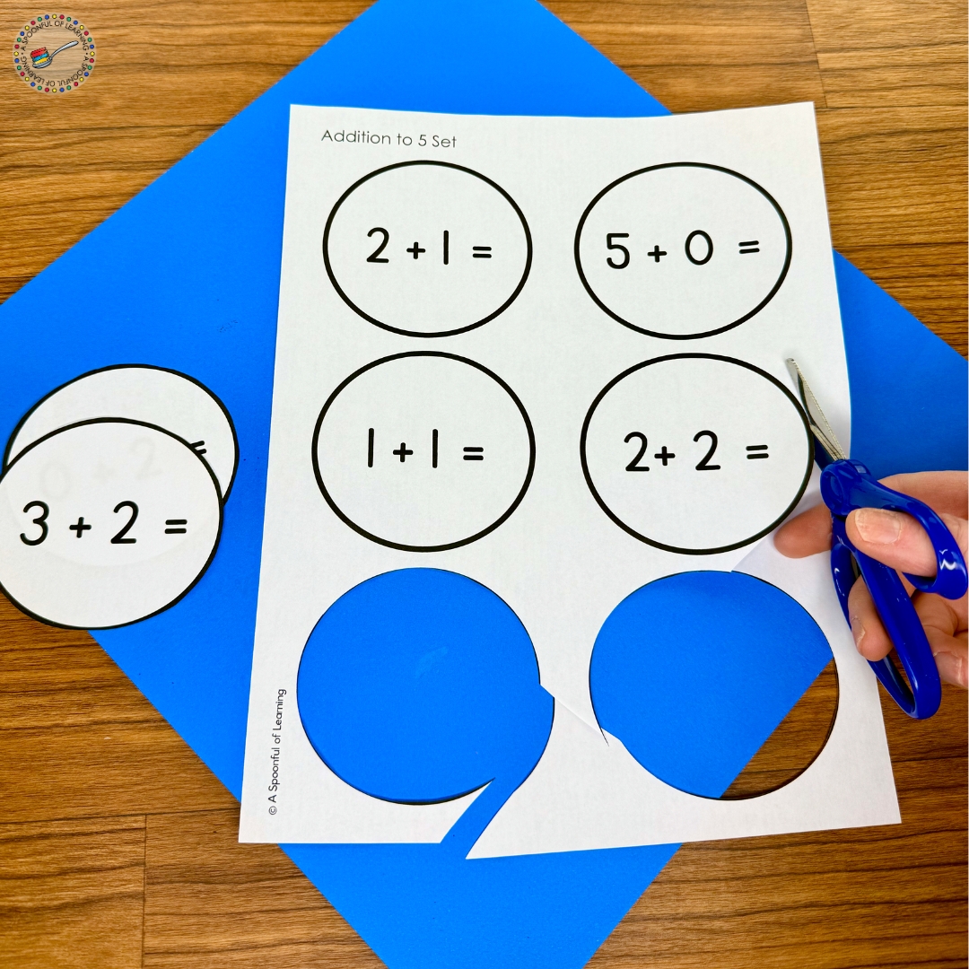 Cutting out the snowball pieces with addition equations